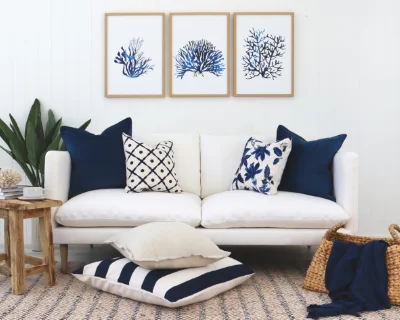A Hamptons themed room is shown with coordinated throw cushions.