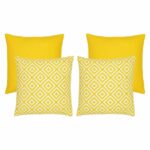 A collection of four yellow outdoor cushions featuring two geometric design cushions and two plain cushions
