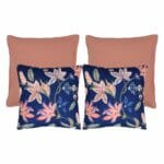 A collection of four cushion featuring 2 plain coral coloured cushions and two floral design cushions.