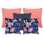 Set of 5 cushions in soft coral and grey tones and featuring floral designs.