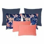 A set of 6 cushion covers in coral, navy and floral colours and designs