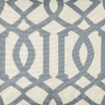 Close up of square cushion cover with duck egg trellis print