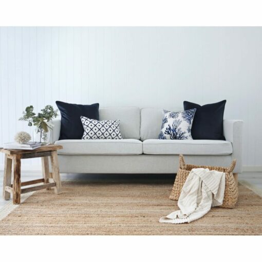 Minimalist yet elegant living room in Hamptons blue colours and abstract and coral prints