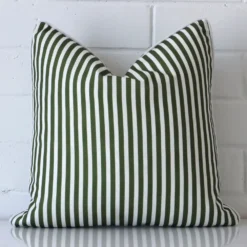 An eye-catching outdoor square cushion cover featuring a hue that is green. It has a unique striped style.