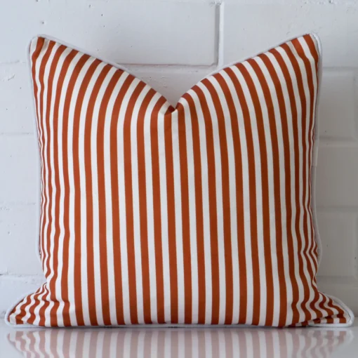 Striking square terracotta cushion cover featuring a striped style on quality outdoor fabric.
