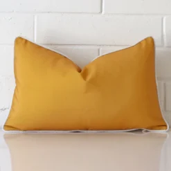 Vibrant outdoor cushion cover in a stylish rectangle size with mustard colouring.