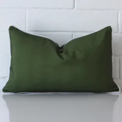 .Gorgeous rectangle outdoor cushion cover that has an olive green hue.