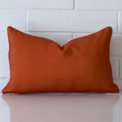 Front view of terracotta cushion. Crafted from a special outdoor material.