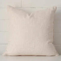 Striking square cream cushion cover made from a linen fabric.