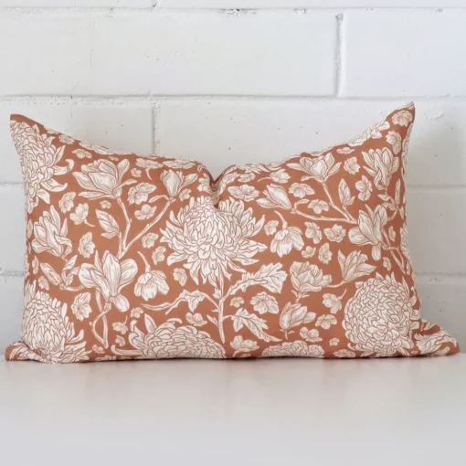 Vibrant floral linen cushion cover in a stylish rectangle size with terracotta colouring.