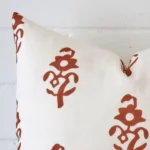A detailed shot of this terracotta patterned cushion cover that has linen fabric and a square size.