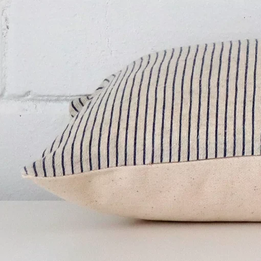 Lateral viewpoint of this designer rectangle cushion. The striped design is shown from the side showing the front and rear panels.