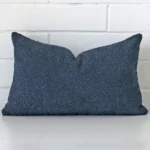 Front view of rectangle cushion. Crafted from a special boucle material in a blue colour.