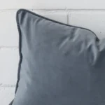 Magnified view of this velvet blue grey cushion cover’s corner. It has a rectangle size.