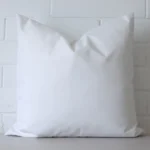 A gorgeous outdoor square cushion in white.