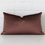 An eye-catching velvet rectangle cushion cover featuring a hue that is chocolate brown.