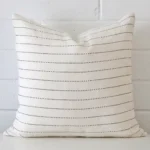 Striking square cushion cover featuring a striped style on quality linen fabric.