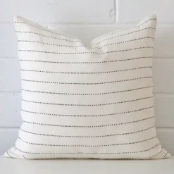 Striking square cushion cover featuring a striped style on quality linen fabric.