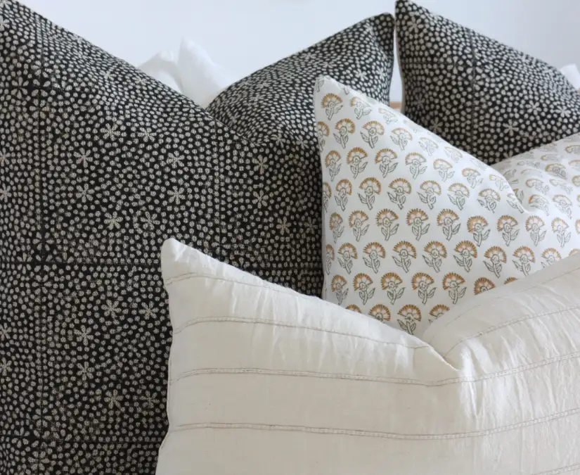 Close up view of cushion cover fabric showing texture and print.