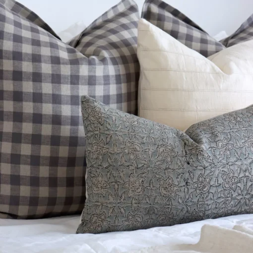 A close-up view of the Darcy bed set, providing clearer detail of the four designer cushions.
