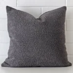 Striking square dark grey cushion cover featuring a quality boucle fabric.