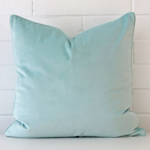 Vibrant velvet cushion cover in a stylish square size with duck egg colouring.