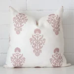 A gorgeous linen square cushion in pink. It has an eye-catching patterned design.