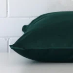 Close side shot of this emerald green velvet cushion cover.