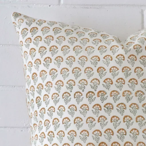 Close up image of designer square cushion. The image allows you to see the floral style more thoroughly.