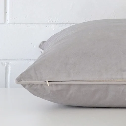 Side angle shot of velvet square cushion cover. The flint grey hue is shown.