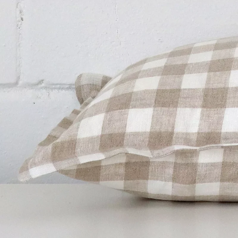 Side edge of gingham square cushion. The designer material can be seen from this lateral viewpoint.