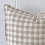 Precision shot of this square cushion cover. It is possible to see the gingham style and designer fabric in greater depth.