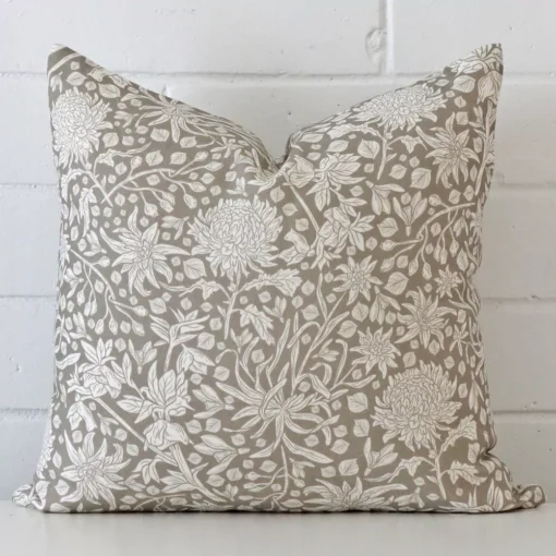 Gorgeous square linen cushion cover that has a grey hue. It has a graceful floral design.