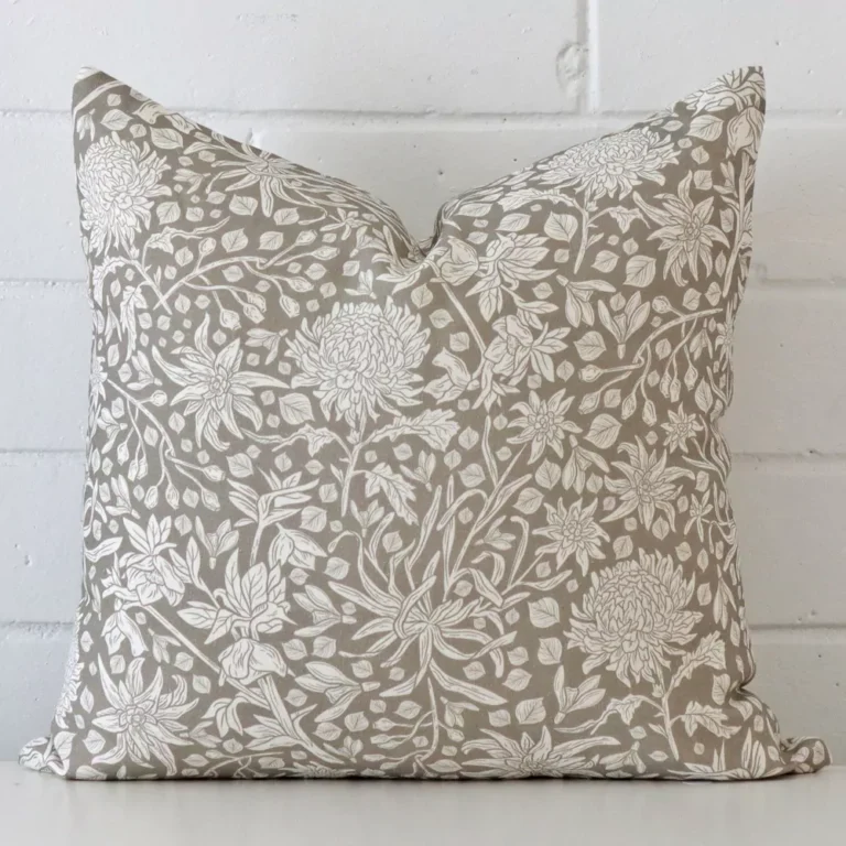 Gorgeous square linen cushion cover that has a grey hue. It has a graceful floral design.