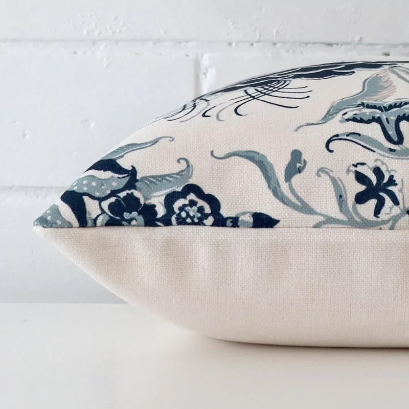 Side edge of patterned square cushion. The linen material can be seen from this lateral viewpoint.