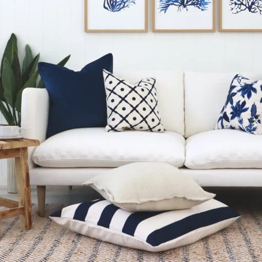 A series of Hamptons cushions styled on light seating.