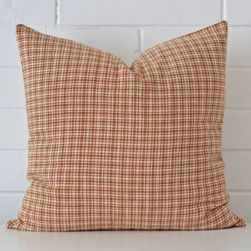 A gorgeous designer square cushion. It has an eye-catching gingham design.