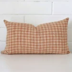 Rectangle gingham cushion cover in sitting upright in front of a brick wall. It has been made from a quality designer material.