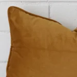 Close up image of velvet rectangle cushion. The image allows you to see the honey mustard hue more thoroughly.