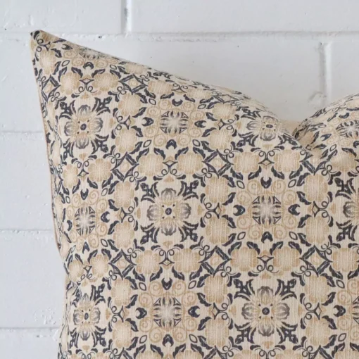 Close up view showing a corner of this designer cushion in a square size.