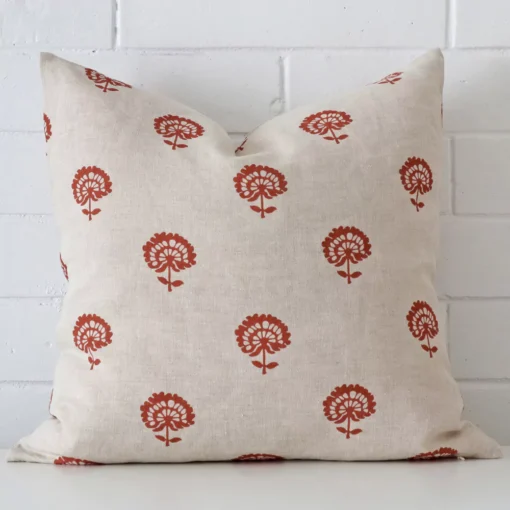 Vibrant floral linen cushion cover in a stylish square size with rust colouring.