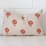 A gorgeous linen rectangle cushion in rust. It has an eye-catching floral design.