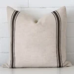 An eye-catching linen square cushion cover featuring a hue that is charcoal. It has a unique striped style.