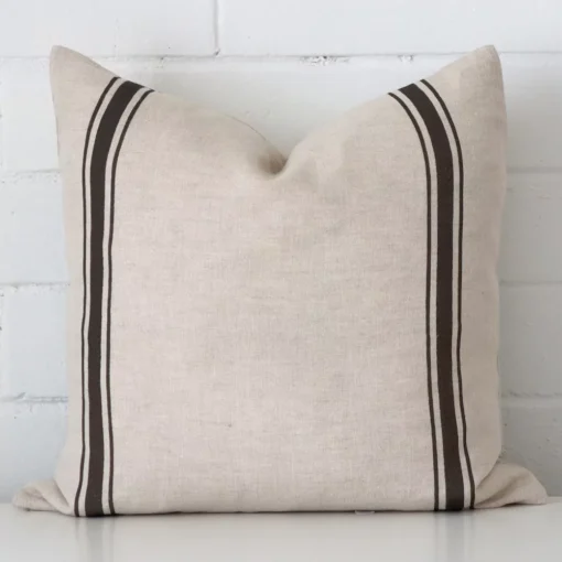 An eye-catching linen square cushion cover featuring a hue that is charcoal. It has a unique striped style.
