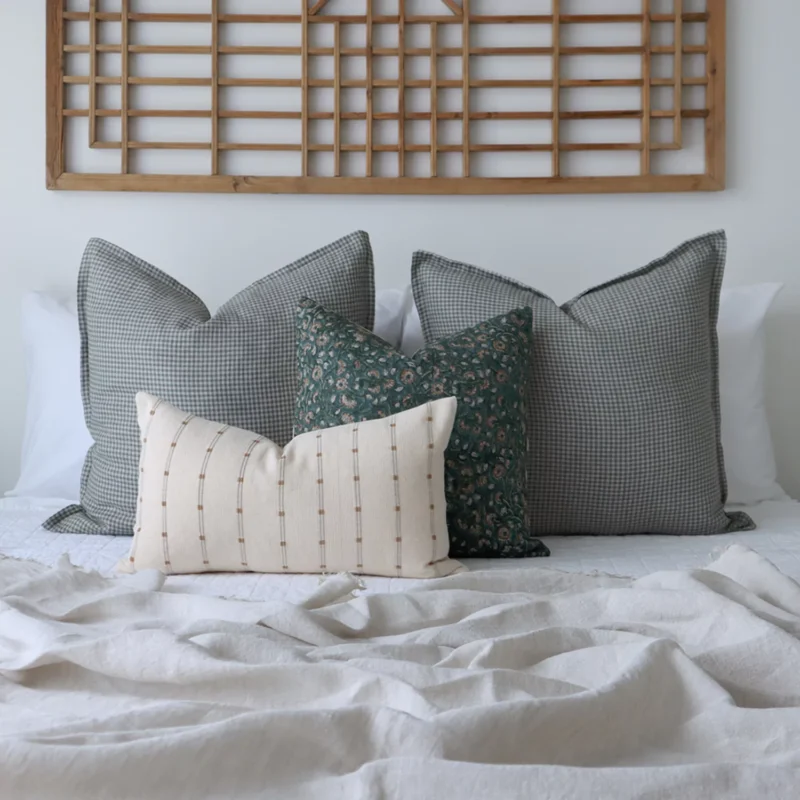 jude-bed-cushions-set-4-designer-covers-cola1157 A set of 4 designer cushions complementing white walls of a bedroom.
