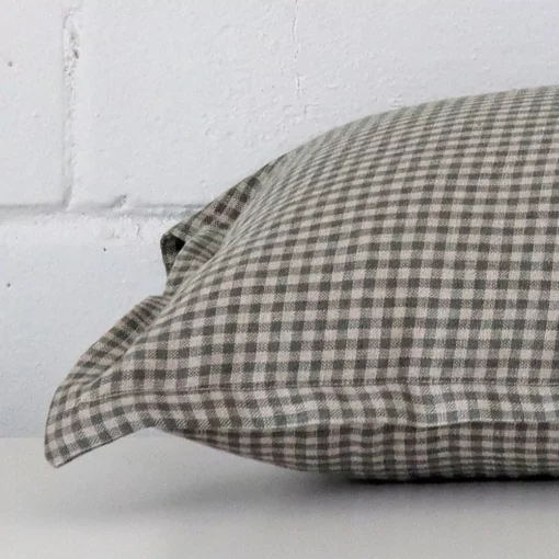 A side view of gingham cushion that has designer fabric and a rectangle size.