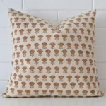 An eye-catching designer square cushion cover. It has a unique floral style.