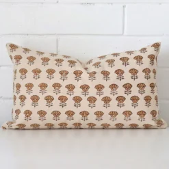 A premium designer cushion boasting a floral design and in a rectangle size.