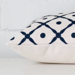 Lateral viewpoint of this linen rectangle cushion. It is showing the front and rear panels.