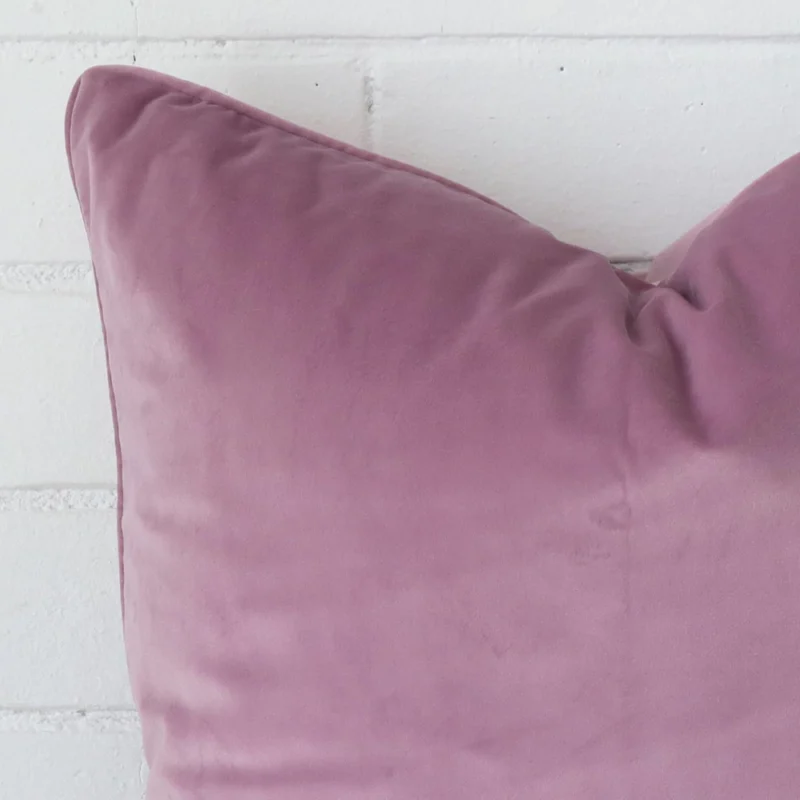 Very close photo of lavender cushion. The shot shows the velvet material and square dimensions with more clarity.